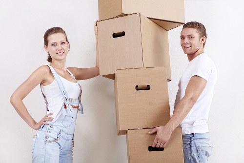 Organized flat removals in Southtottenham with labeled boxes and wrapped furniture
